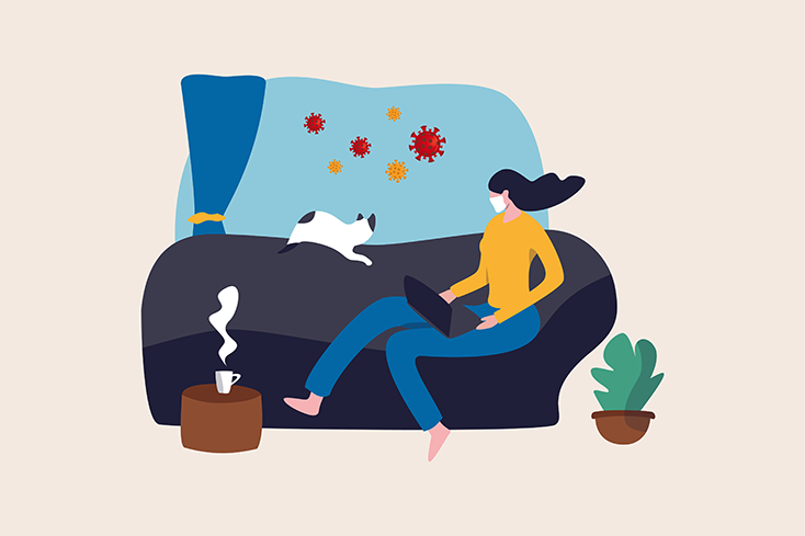 Person wearing facemask sitting on couch